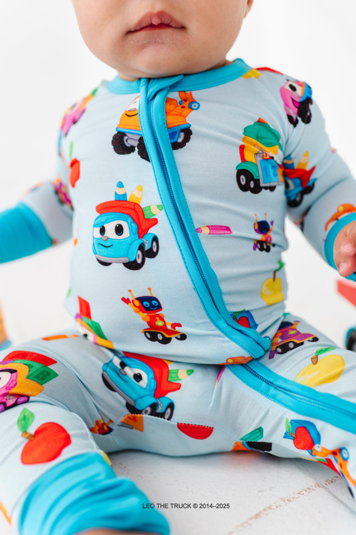 Close-up shot of colorful Leo the Truck bamboo pajamas with two-way zip romper and convertible cuffs