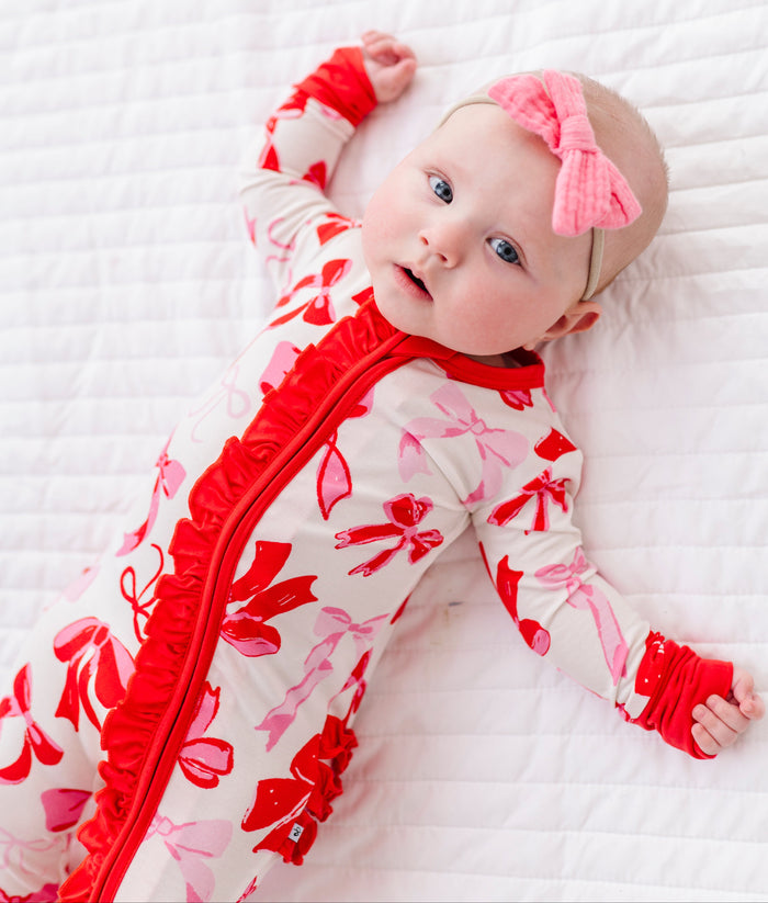 Baby wearing Blushing Bows ruffle convertible romper made from bamboo viscose