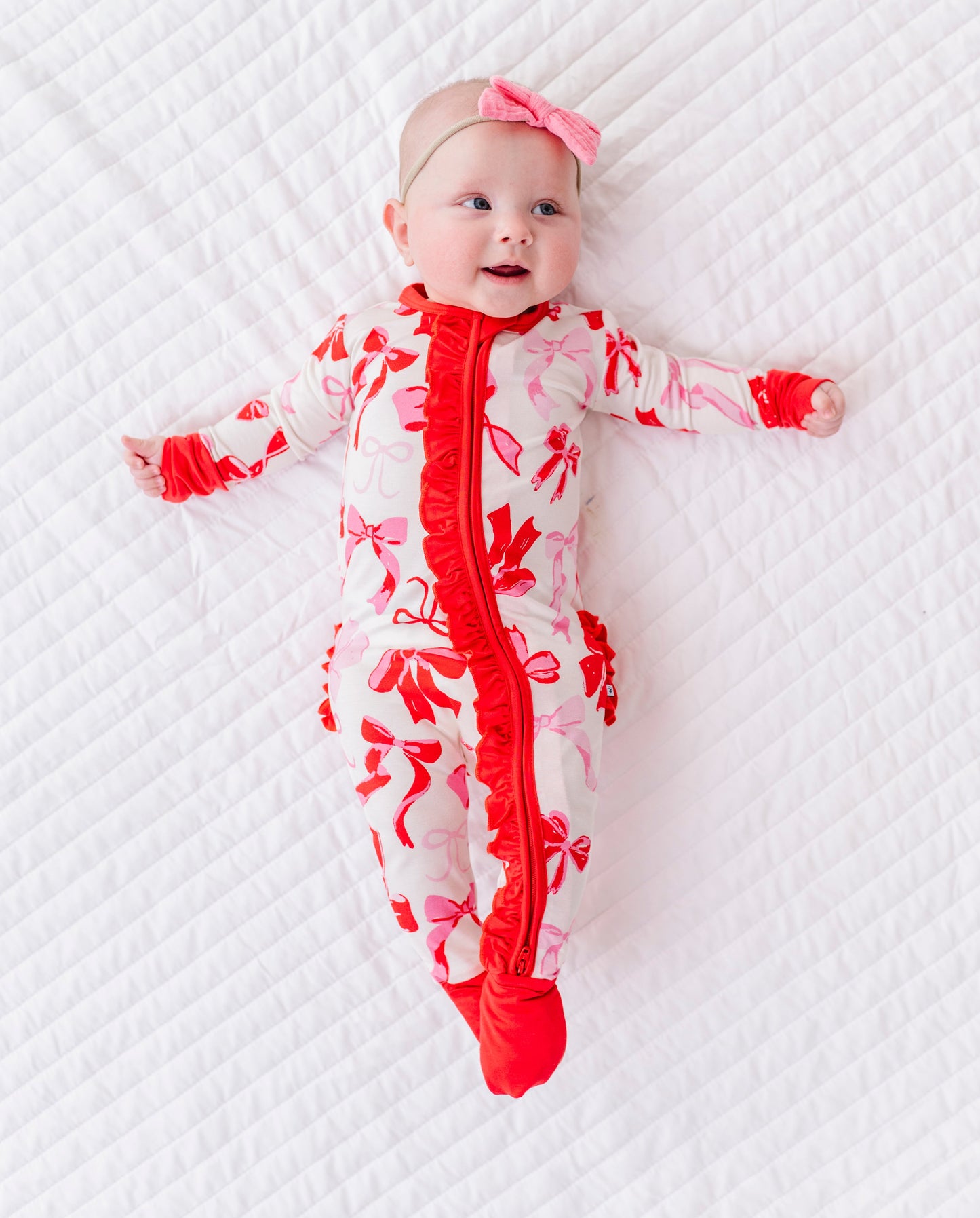 Blushing Bows ruffle convertible romper featuring 2-way zipper and soft bamboo fabric