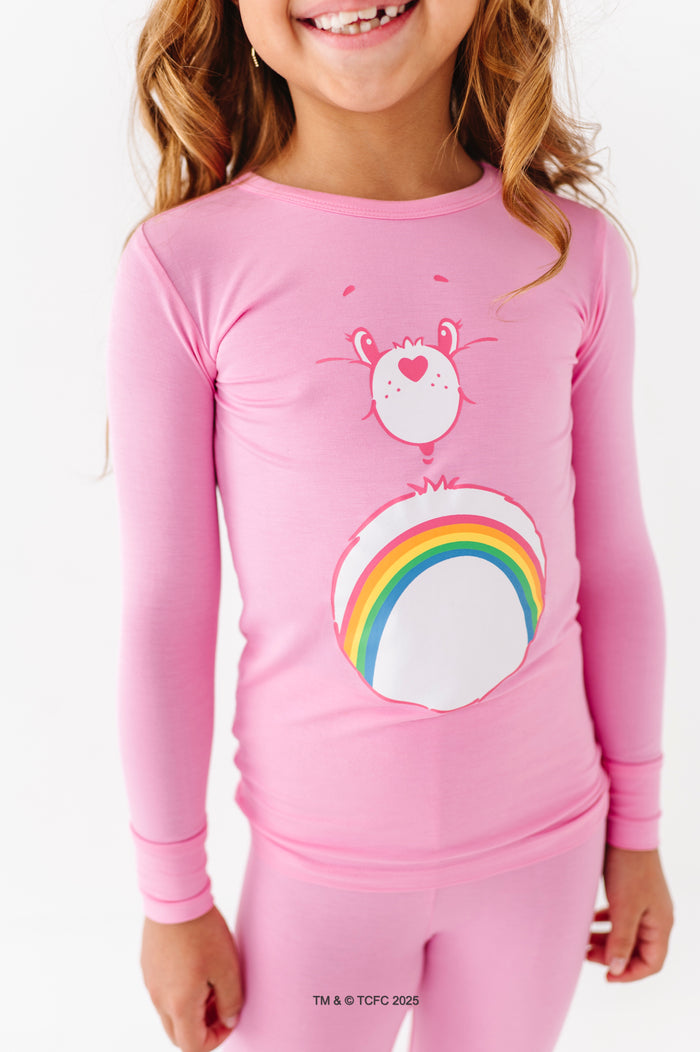 Close-up of Care Bears Cheer Bear long sleeve pajama top with rainbow graphic
