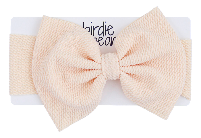 Large beige bow on a white background with 'birdie bear' branding.