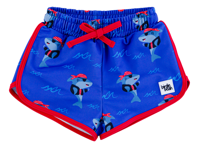 Blue children's swim shorts with shark pattern and red accents on a white background