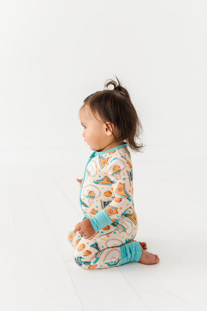 Child wearing a basketball bamboo onesie on a white background
