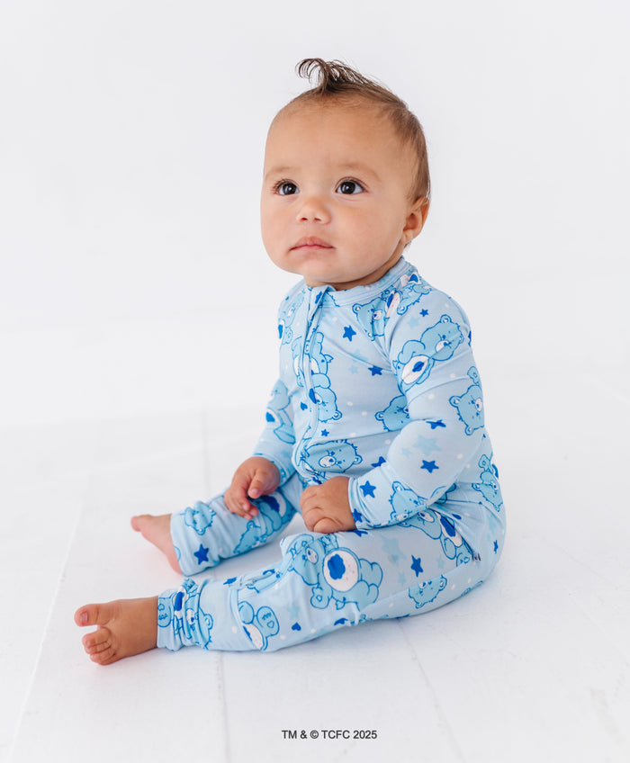 Baby wearing blue Care Bears Grumpy Bear convertible bamboo romper