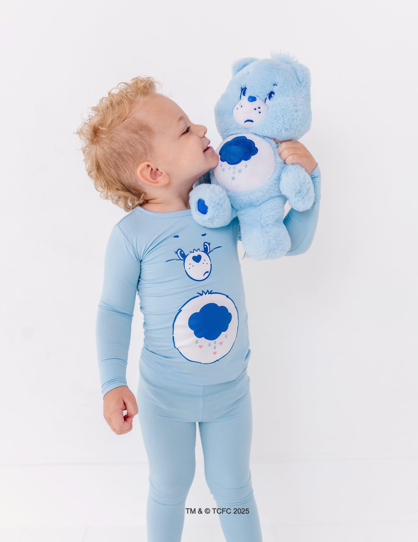 Soft blue Grumpy Bear pajamas designed for bedtime and cozy mornings