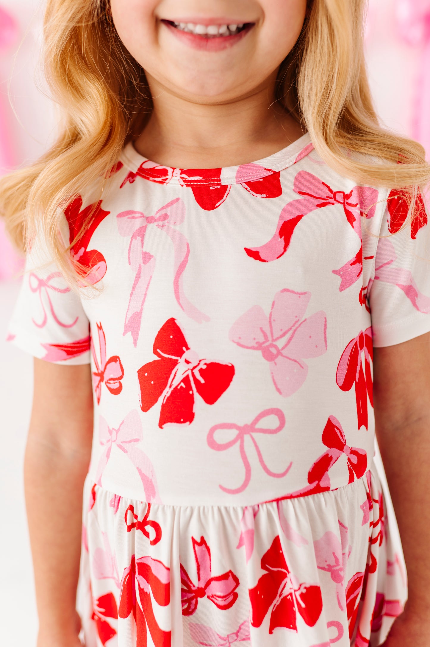Close-up of bow print bamboo fabric on girls twirl dress