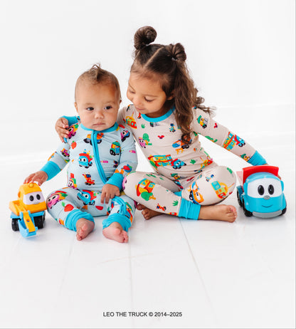 Two children in colorful Leo the Truck bamboo pajamas 