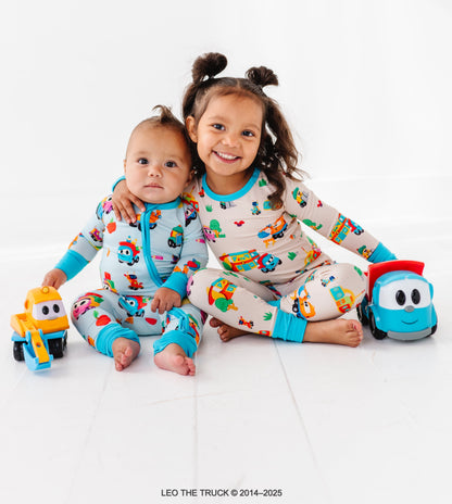 Siblings wearing coordinating Leo the Truck bamboo pajamas