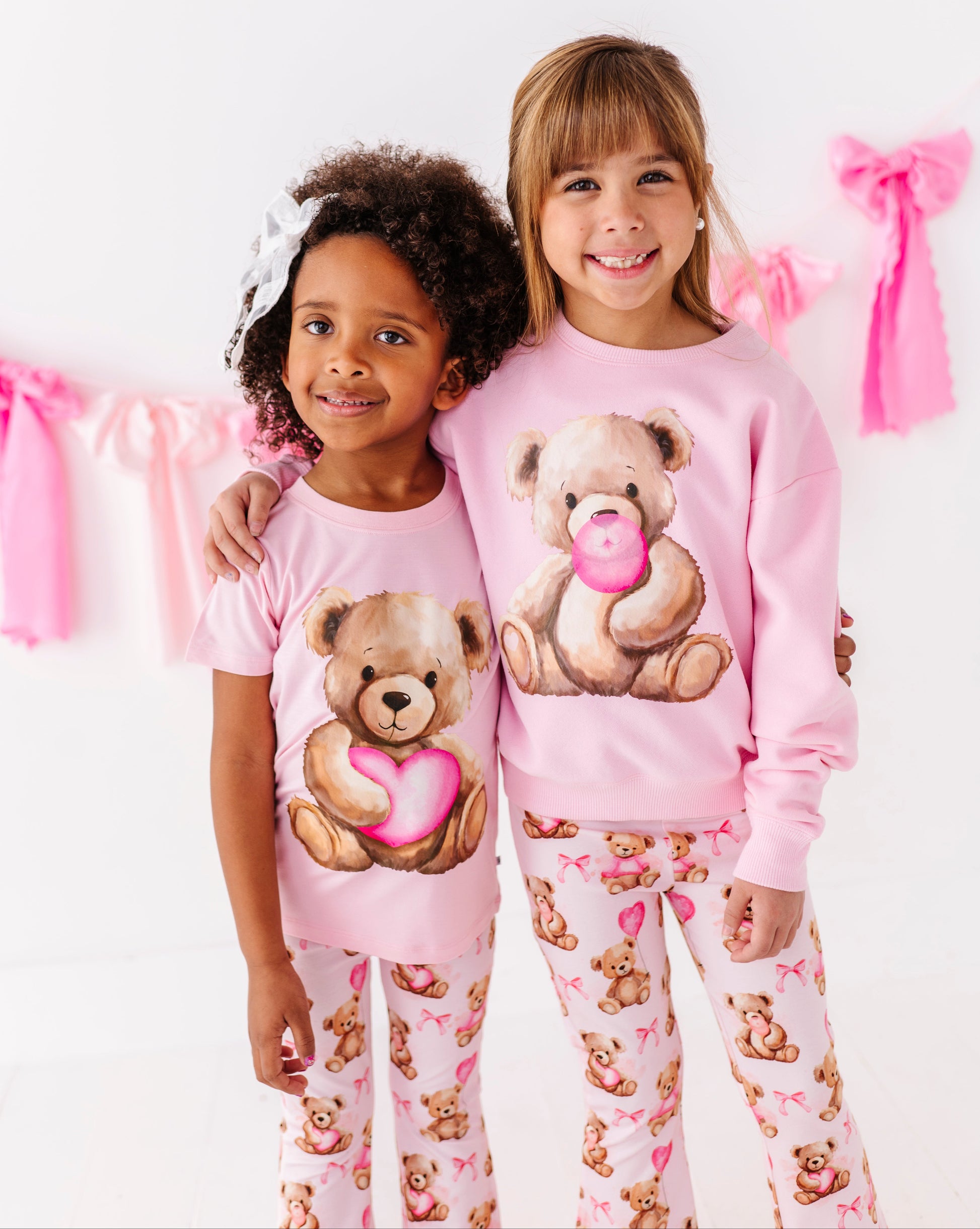 Pink Valentine themed bamboo t-shirt for kids with teddy bear heart illustration