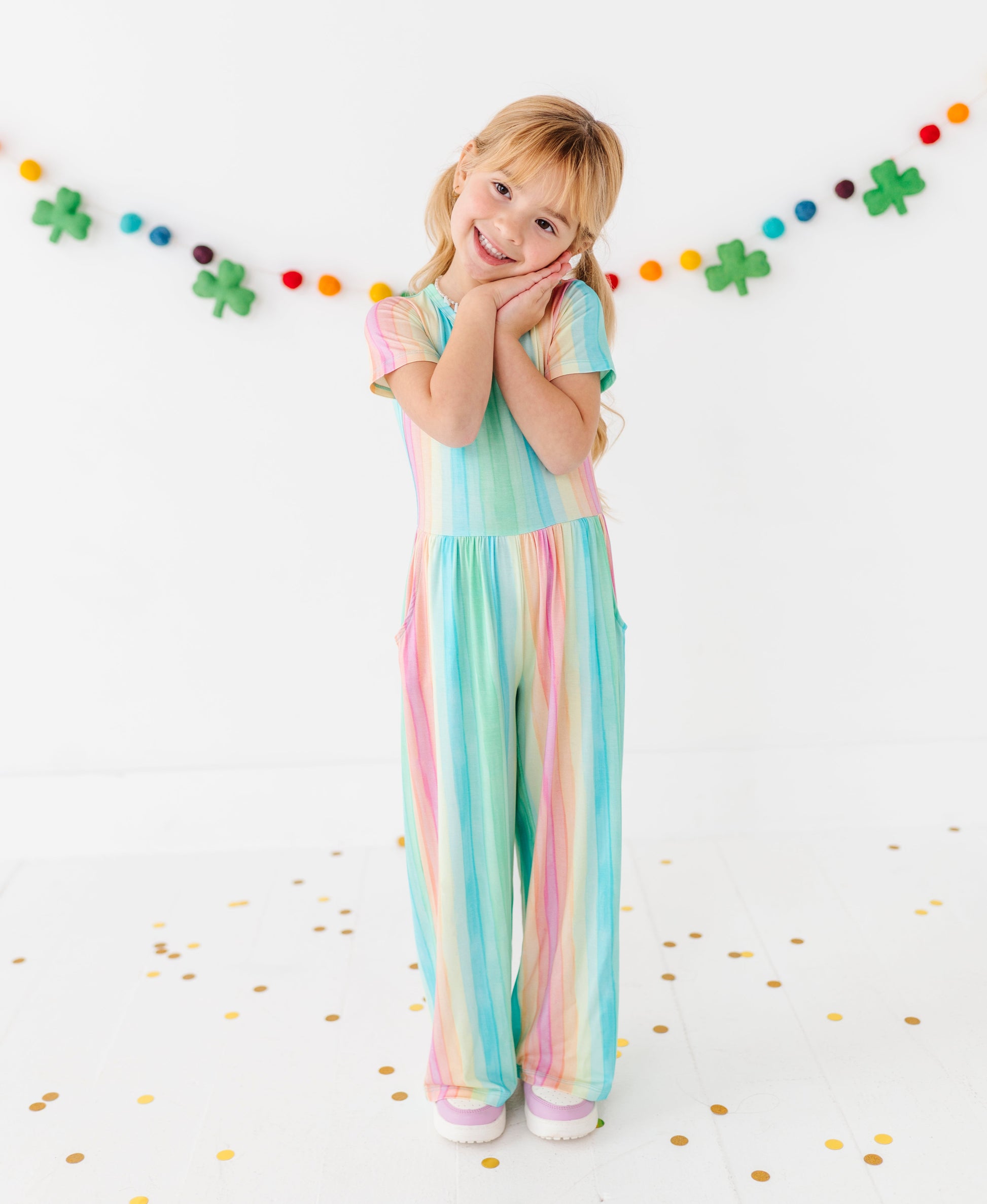 Rainbow stripe jumpsuit for kids made from soft bamboo fabric, full outfit view