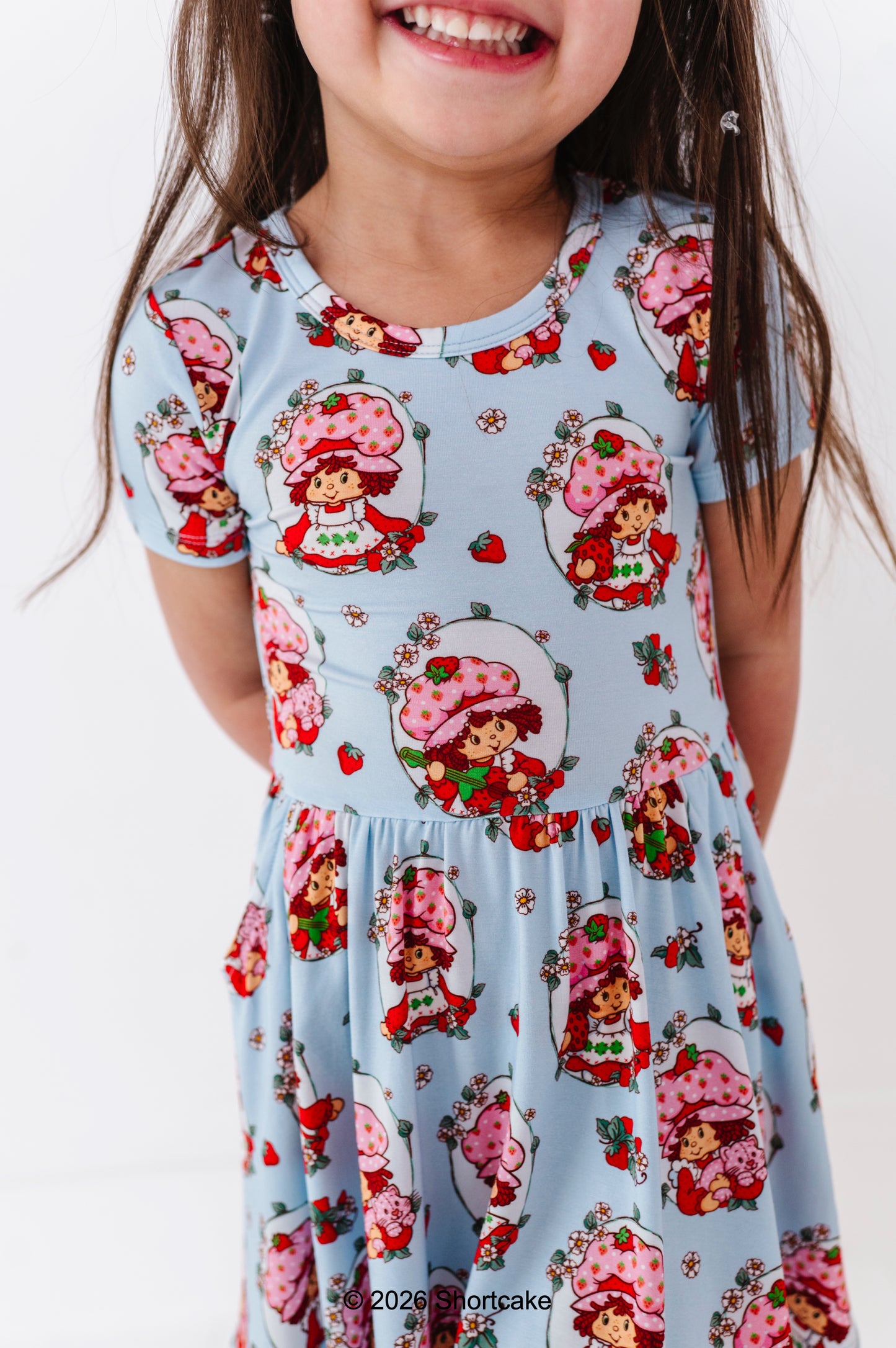 Child wearing an officially licensed bamboo Strawberry Shortcake™ dress 
