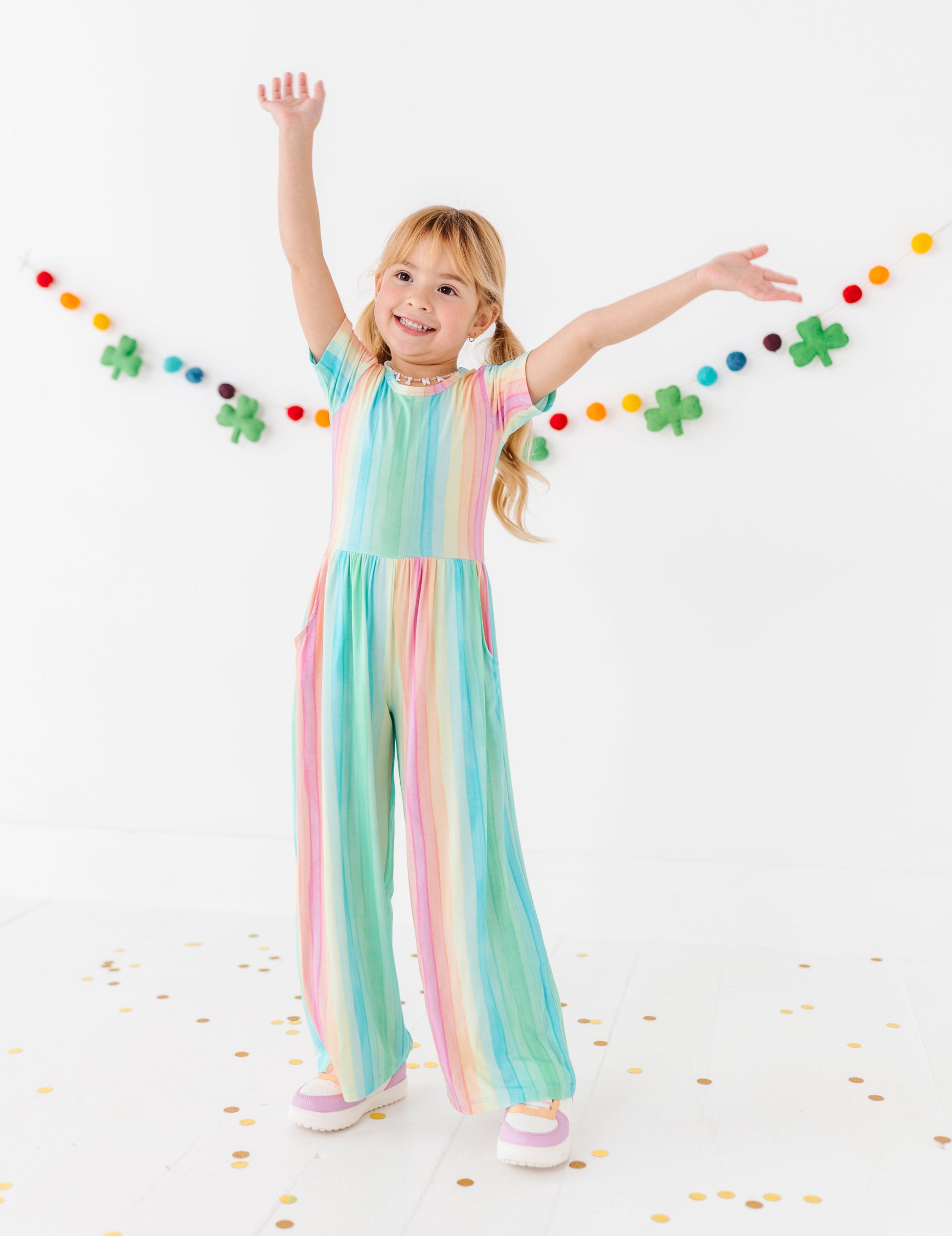 Rainbow stripe jumpsuit for toddlers with lightweight bamboo fabric and playful colors