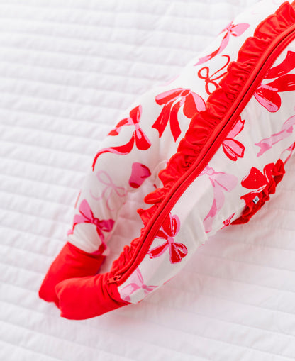 Detail shot of ruffle trim and zipper on Blushing Bows bamboo baby romper
