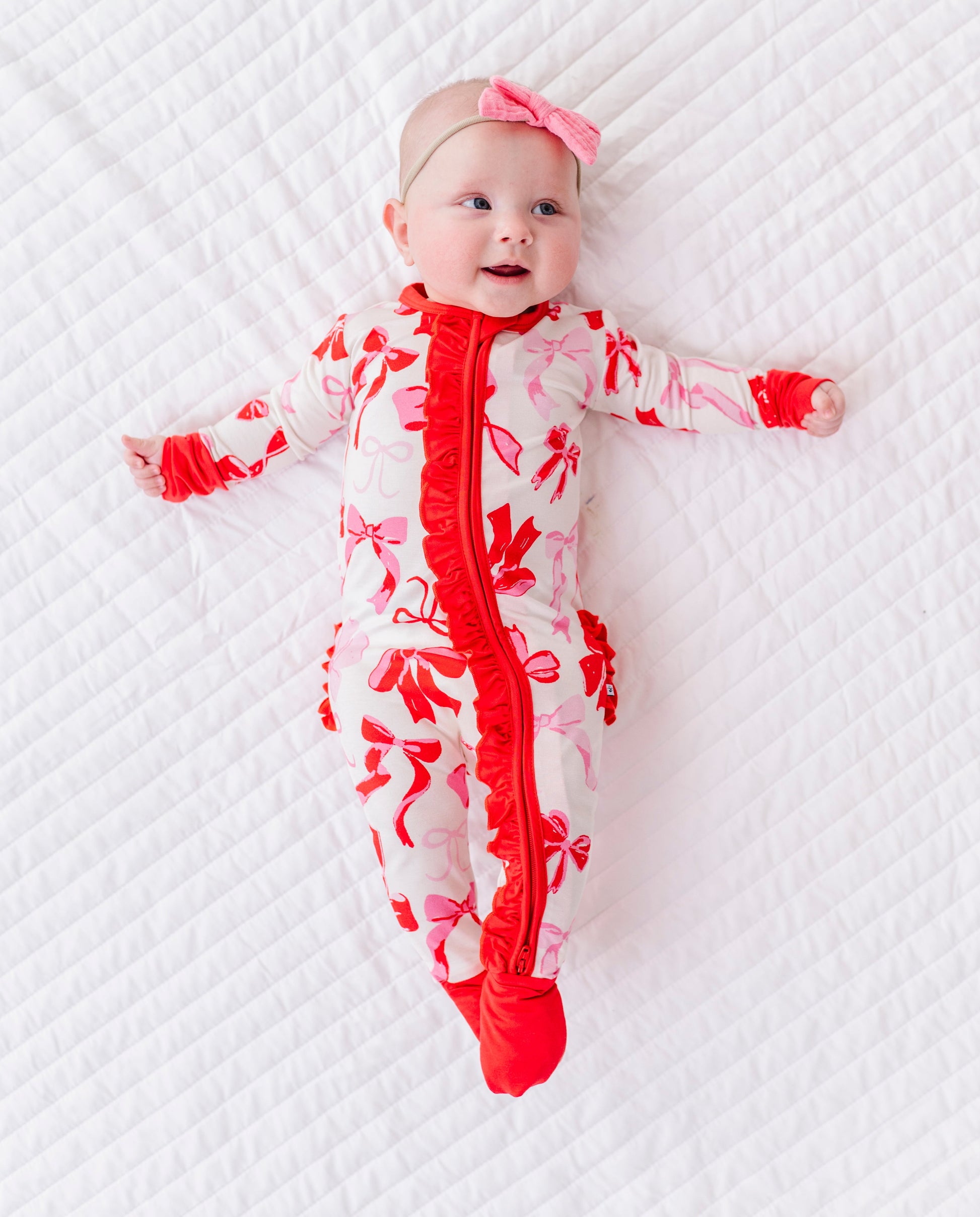 Blushing Bows ruffle convertible romper featuring 2-way zipper and soft bamboo fabric