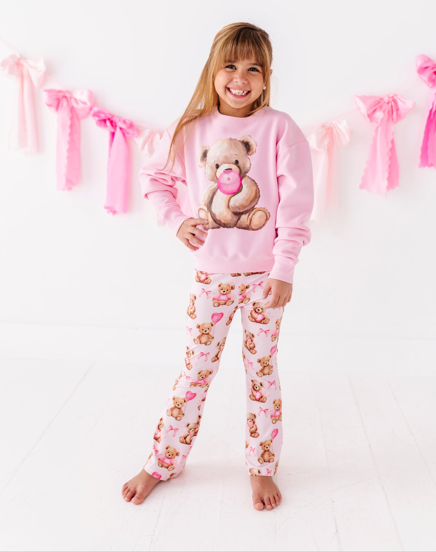 Cozy cotton blend kids sweatshirt with teddy bear graphic on soft pink fabric