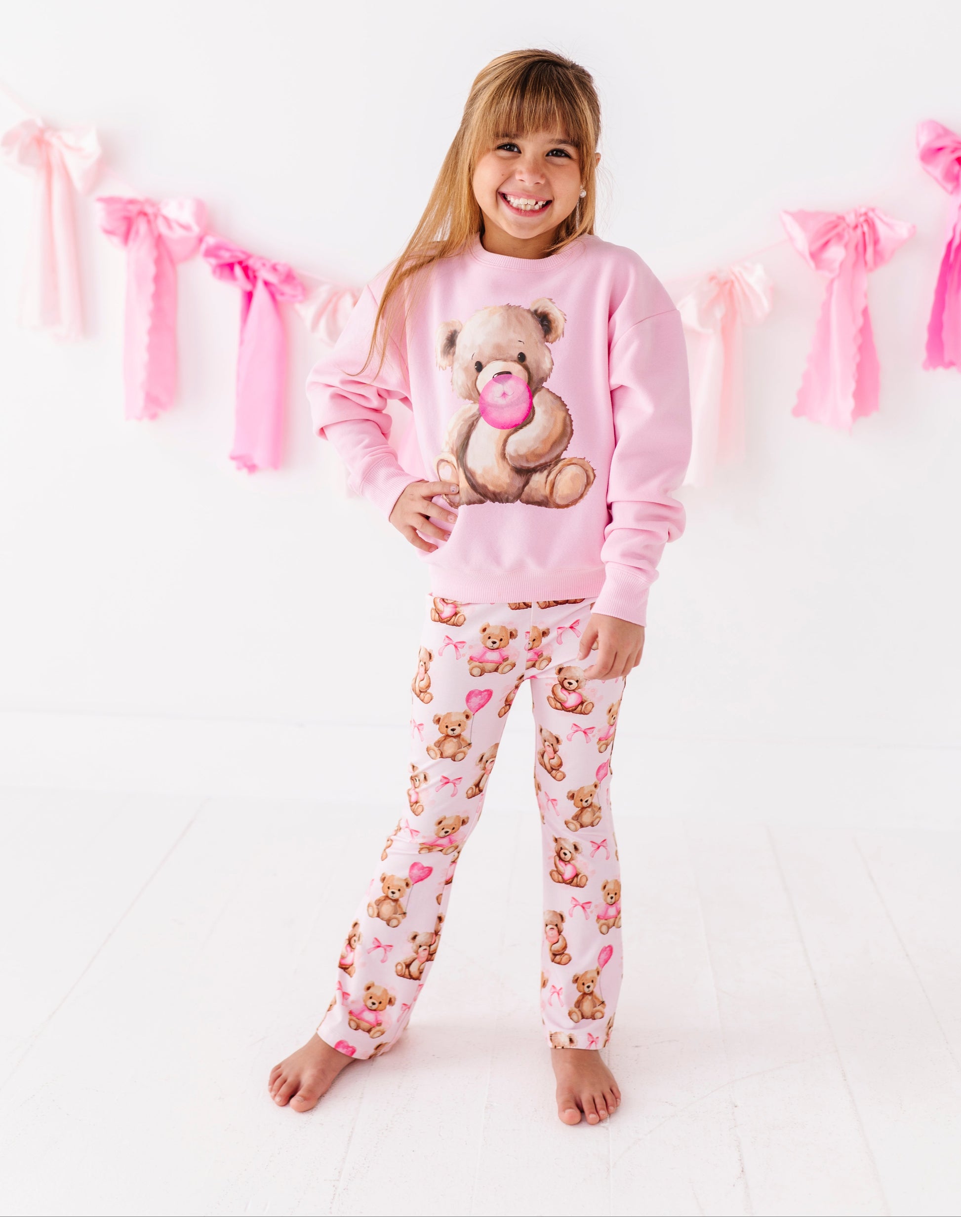 Cozy cotton blend kids sweatshirt with teddy bear graphic on soft pink fabric