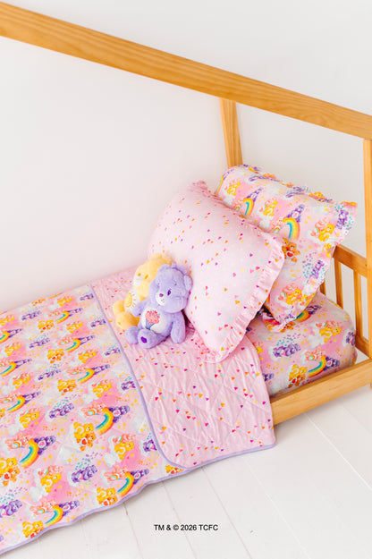 Children's twin-size bed featuring Care Bears™ bedding and plushes