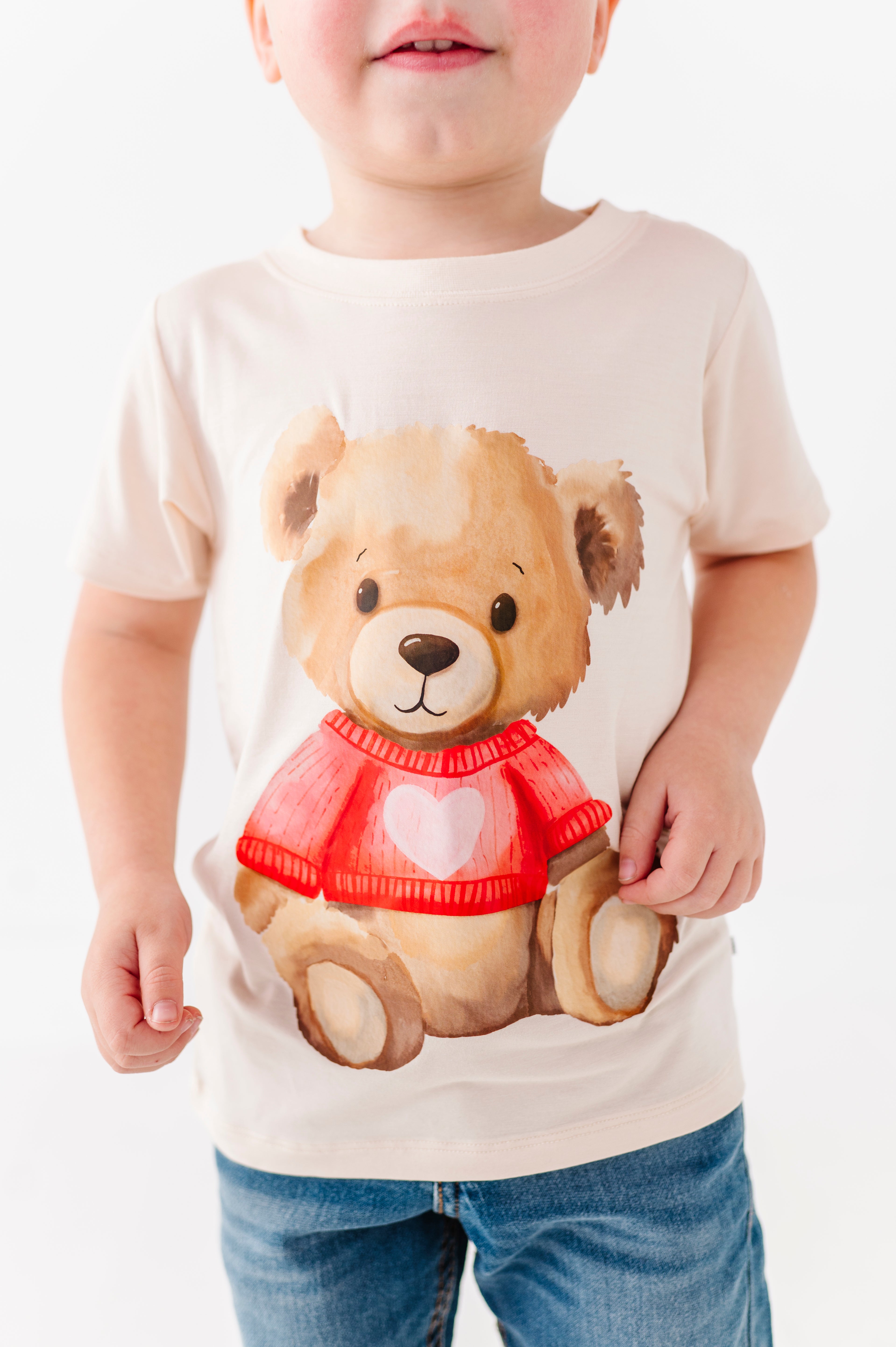 Close-up of teddy bear heart graphic on kids bamboo t-shirt