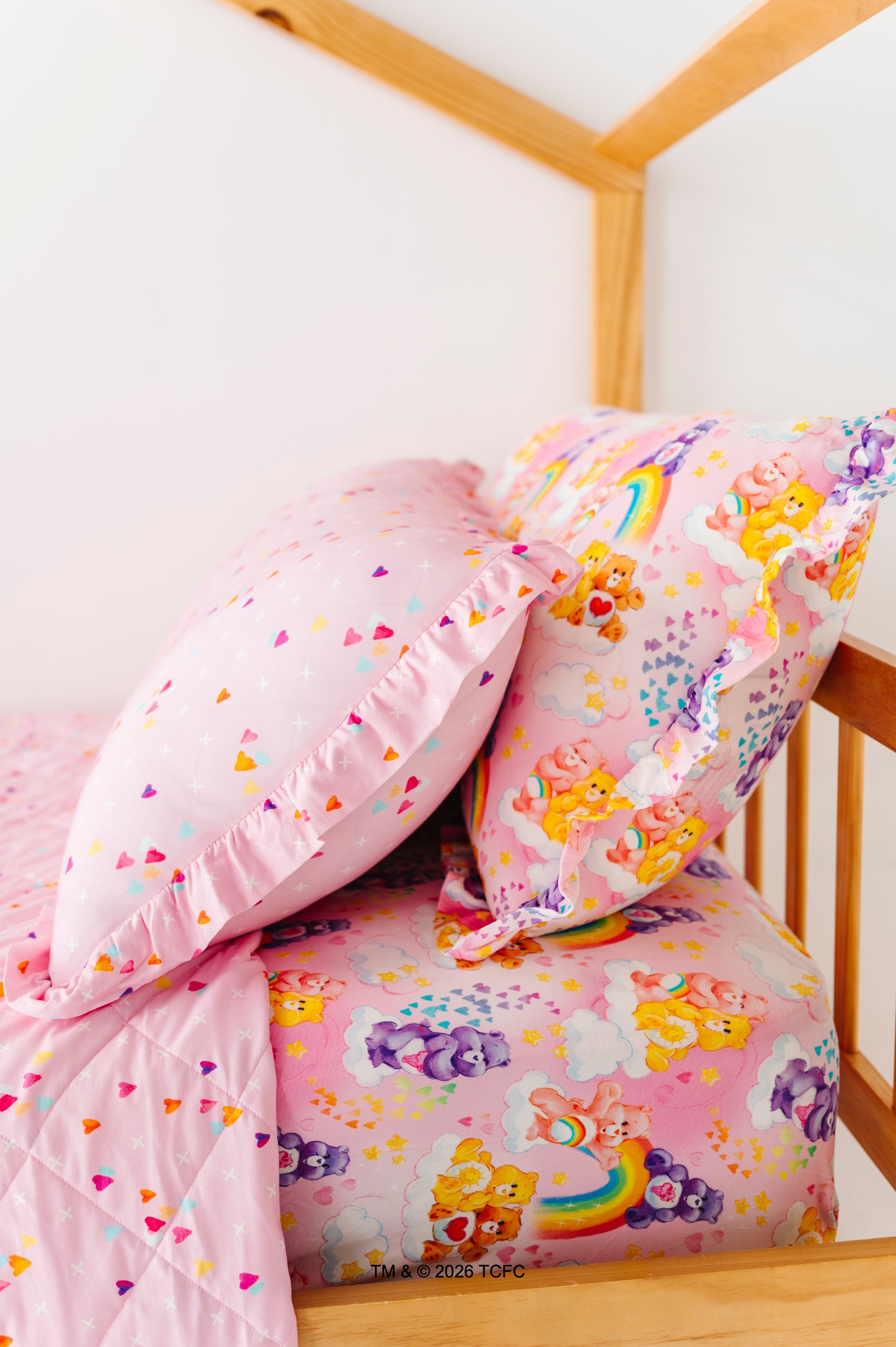 Twin-size bed with bamboo pillow cases, sheets, and quilted blanket featuring the Care Bears™ by Birdie Bean 