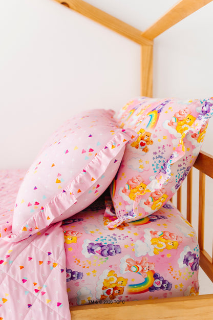 Twin-size bed with bamboo pillow cases, sheets, and quilted blanket featuring the Care Bears™ by Birdie Bean 