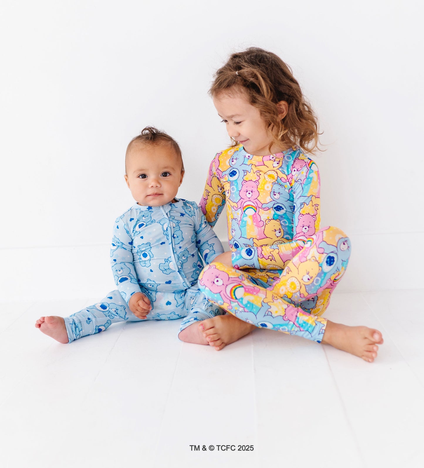 Baby wearing blue Care Bears Grumpy Bear convertible bamboo romper