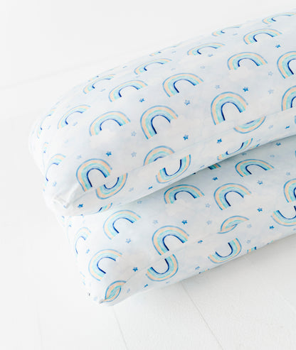 Two bamboo pillow cases with a watercolor rainbow pattern on a white background