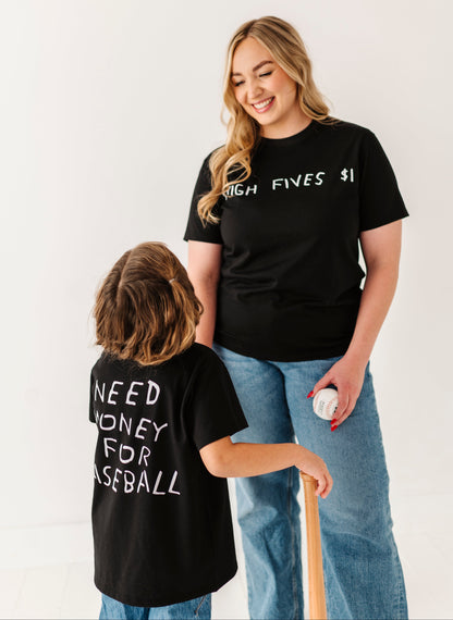 Two people wearing black t-shirts with text, standing against a white background.