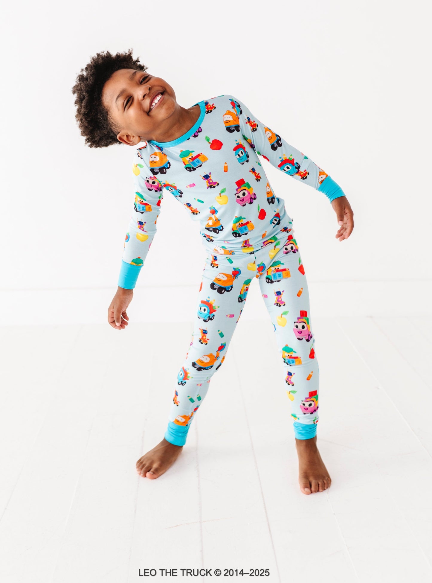 Little boy wearing light blue Leo the Truck bamboo pajamas 