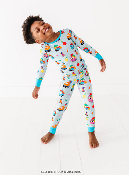 Little boy wearing light blue Leo the Truck bamboo pajamas 