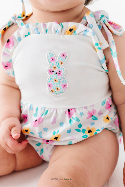 Baby outfit with colorful PEEPS® design and bunny illustration on a plain background