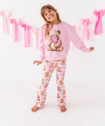 Child wearing pink teddy bear crewneck sweatshirt from Birdie Bean