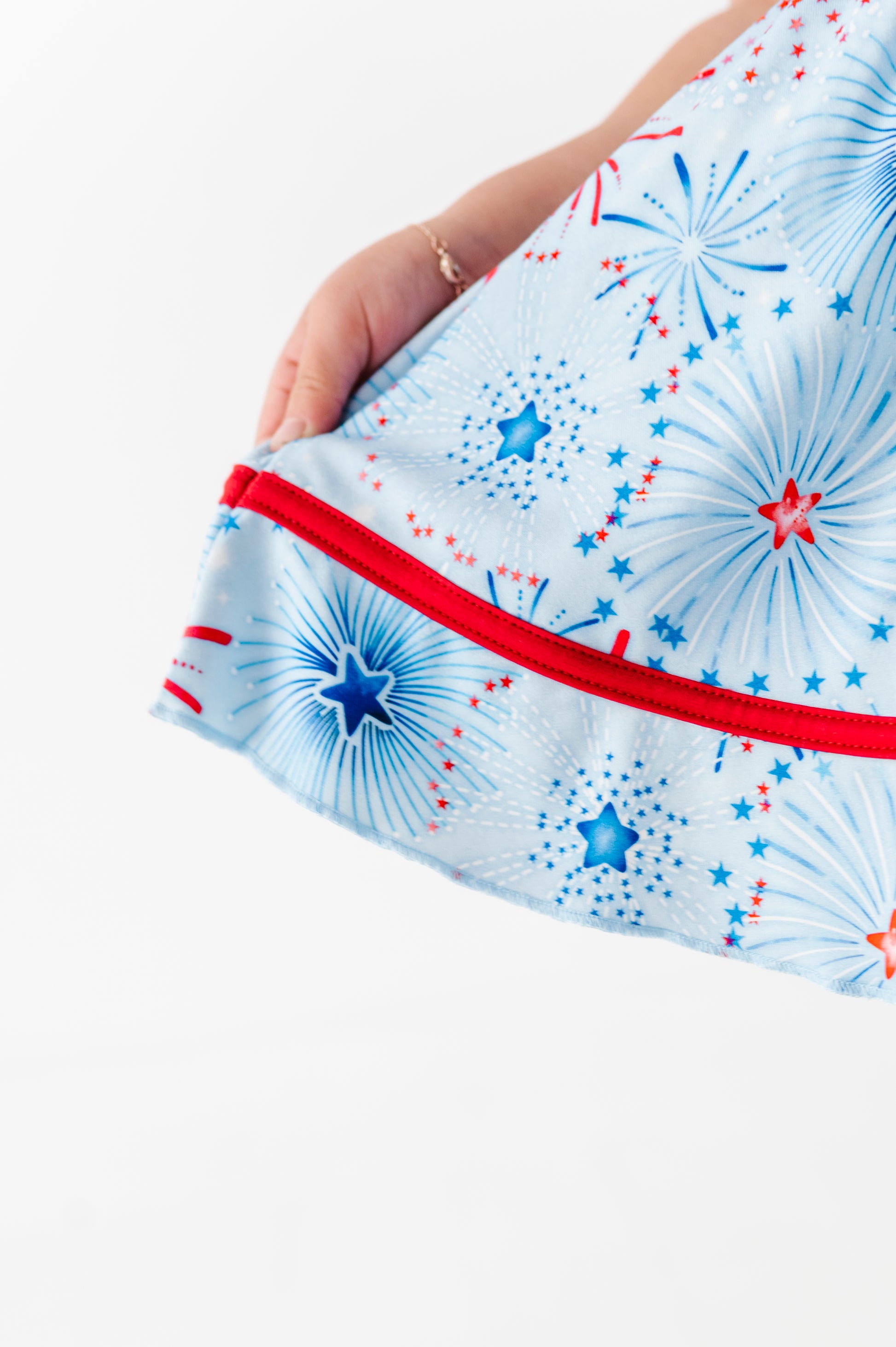 Close-up of the firework pattern on a Birdie Bean bamboo dress 