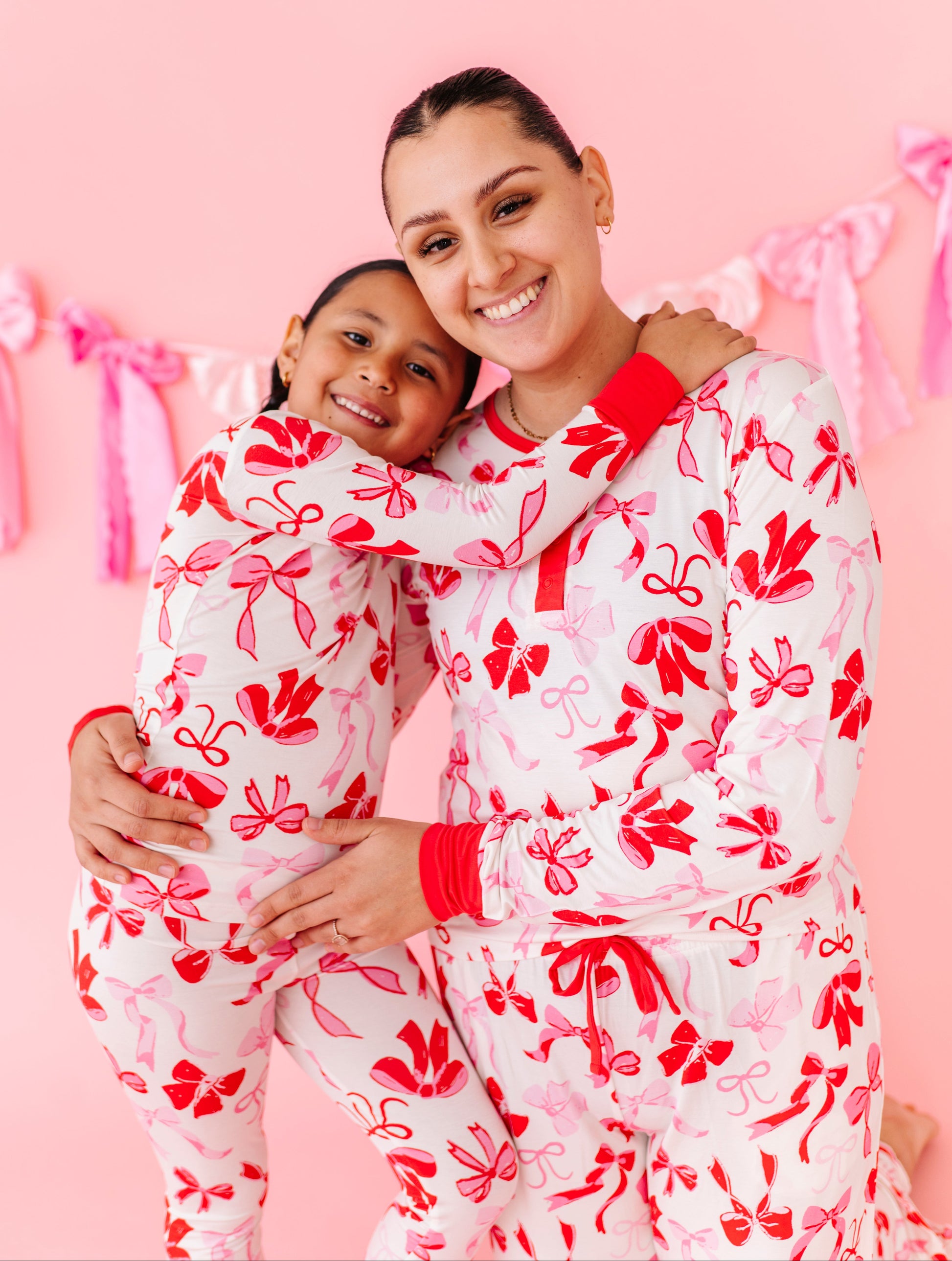 Matching mommy and mini bamboo pajamas in Blushing Bows print