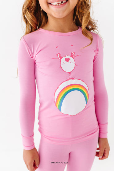 Close-up of Care Bears Cheer Bear long sleeve pajama top with rainbow graphic