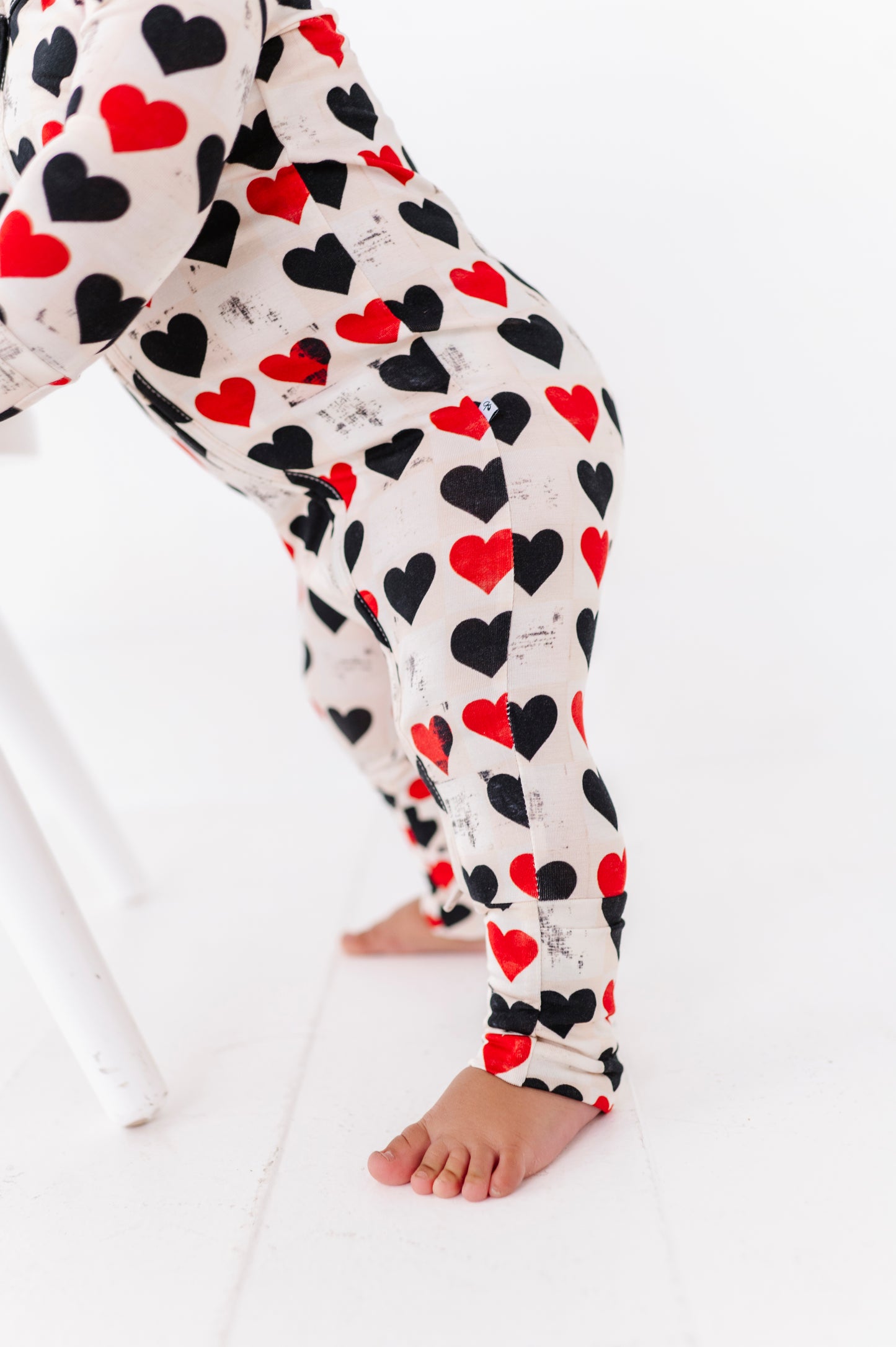 Detail of heart print on King of Hearts bamboo baby romper