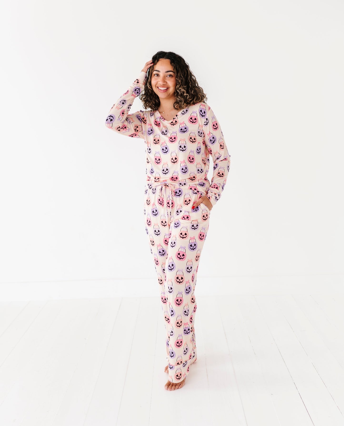 Woman wearing a Halloween bamboo pajama set on a white background