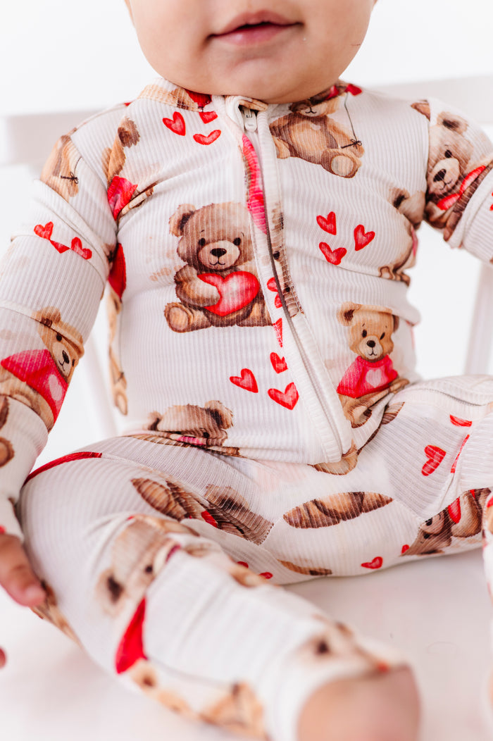 Close-up of bamboo ribbed convertible romper showing teddy bear Valentine print and 2-way zipper