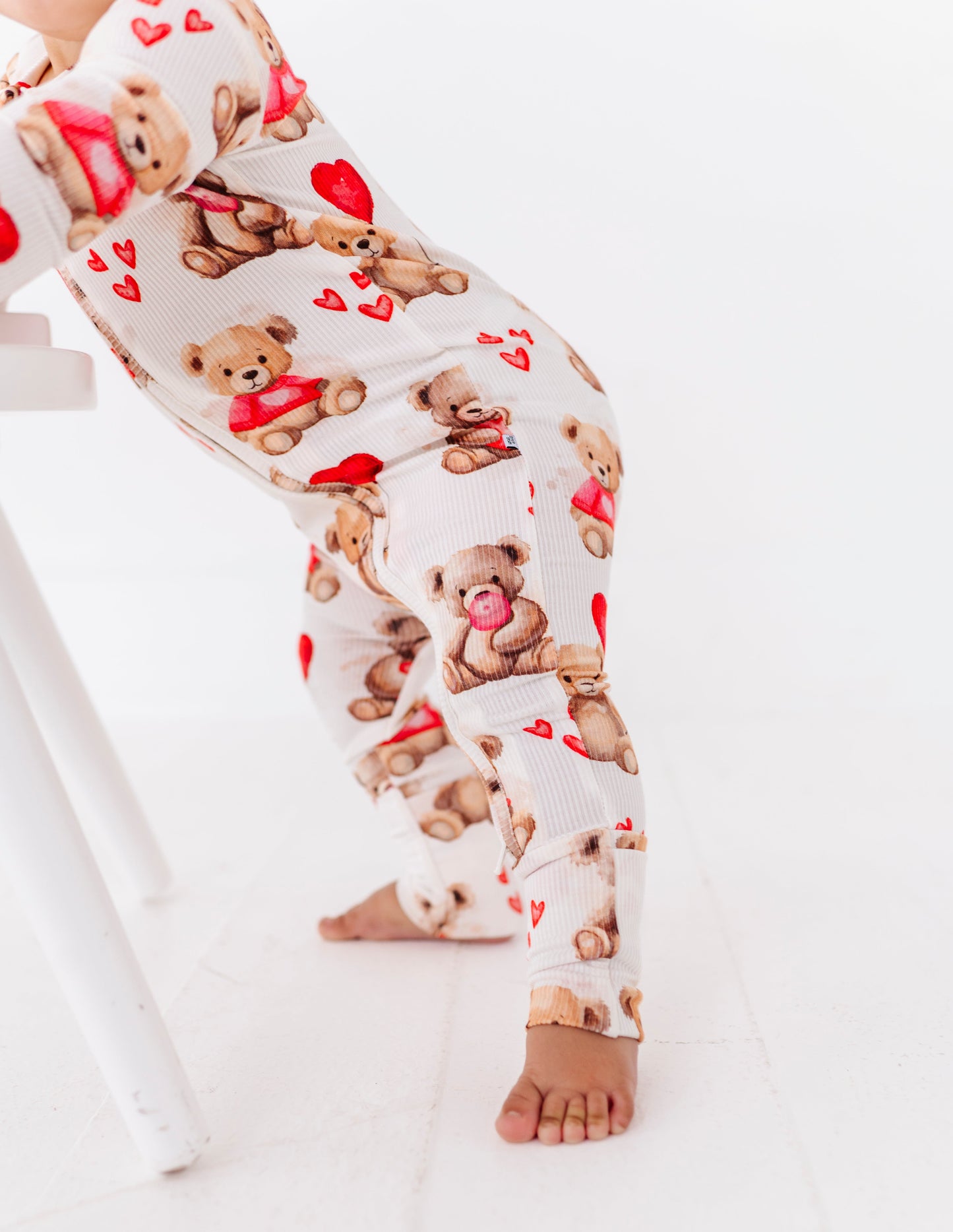 Detail view of ribbed bamboo fabric and Valentine teddy bear print on baby romper
