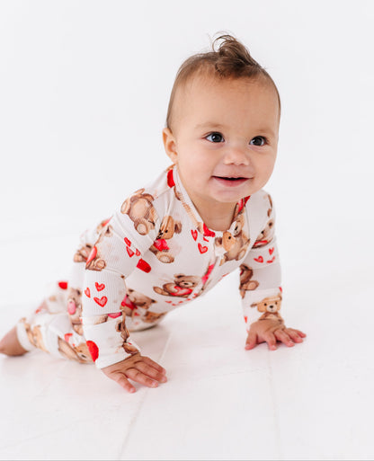 Baby crawling in bamboo viscose convertible footie romper with heart and teddy bear design