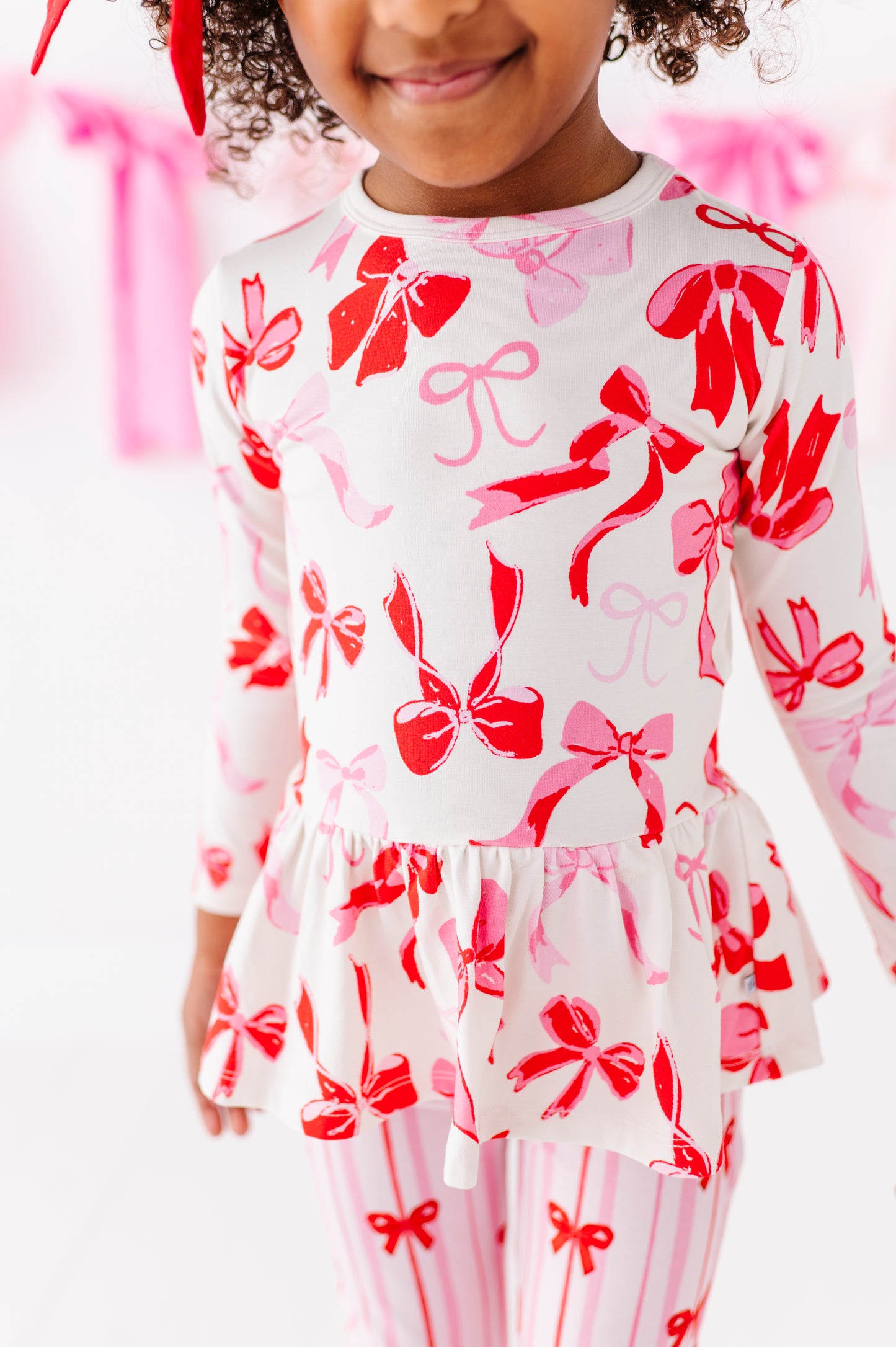 Close-up of Blushing Bows watercolor bow print on bamboo cotton fabric