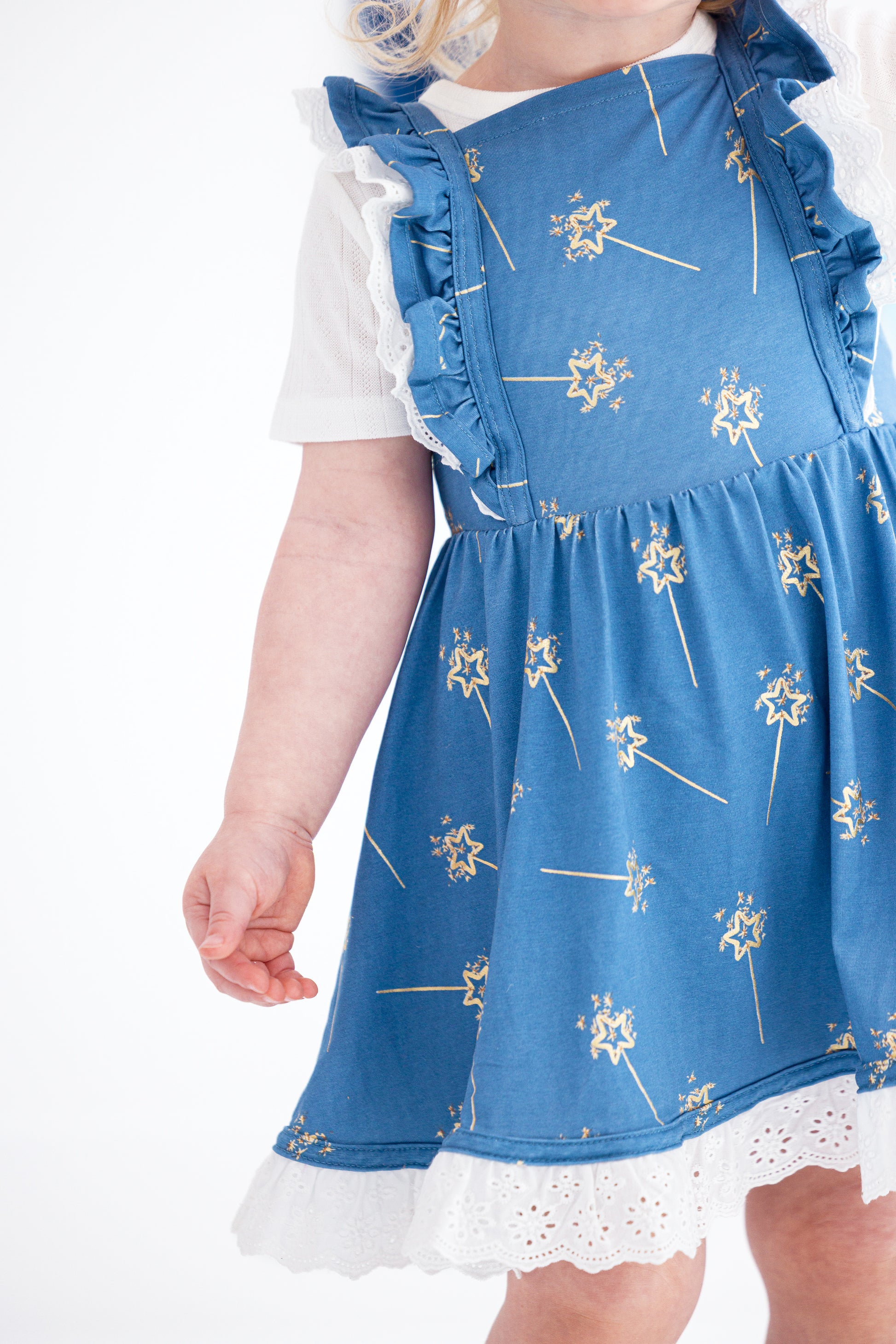 Close-up of gold foil sparkler print on bamboo twirl dress