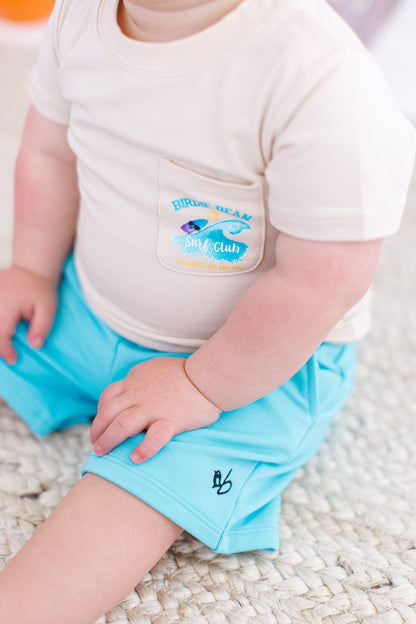 Baby bamboo surf-themed graphic tee with front pocket