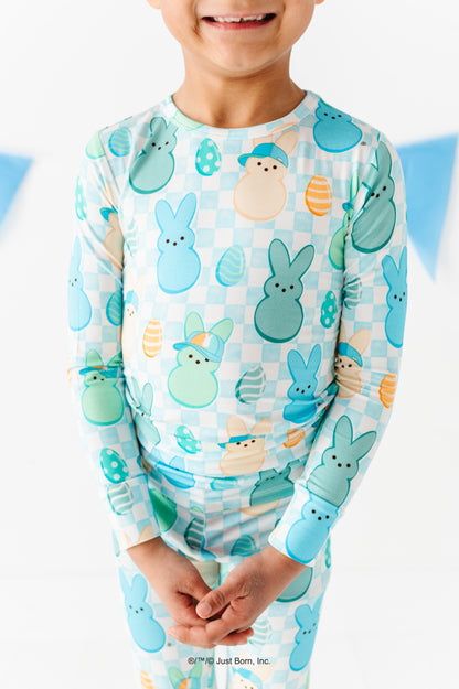 Child wearing a pajama set with PEEPS® pattern on a white background