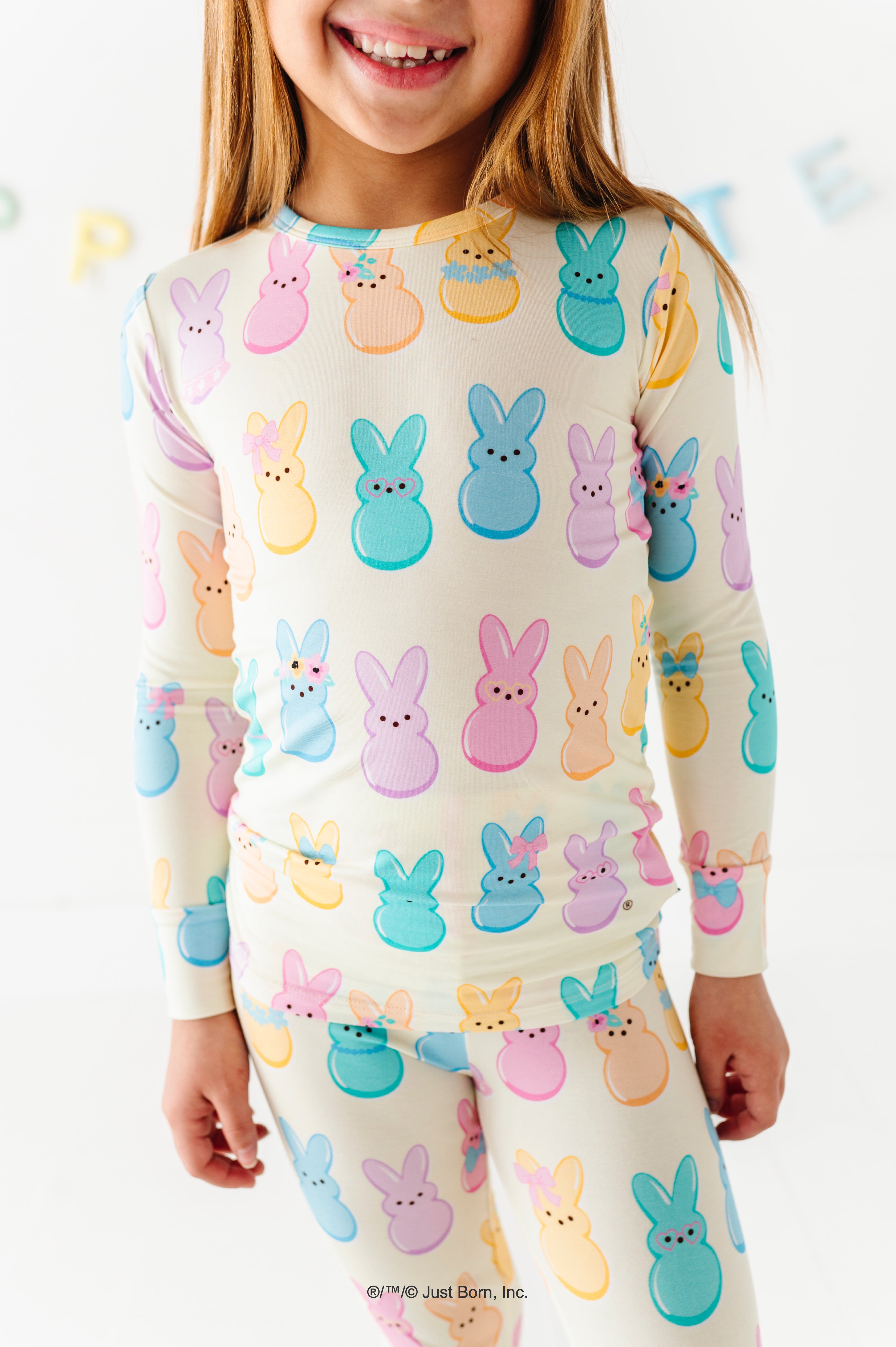 Child wearing pajamas with PEEPS® print on a white background