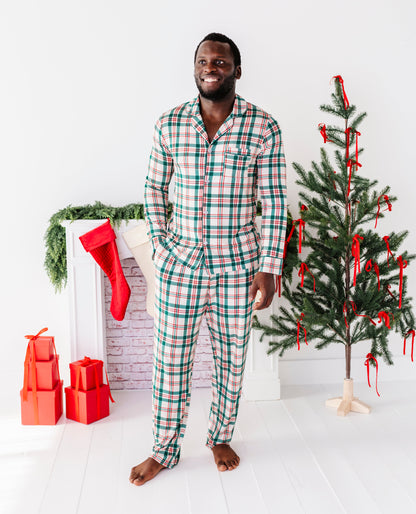 A man wearing a classic Christmas plaid bamboo pajama set 