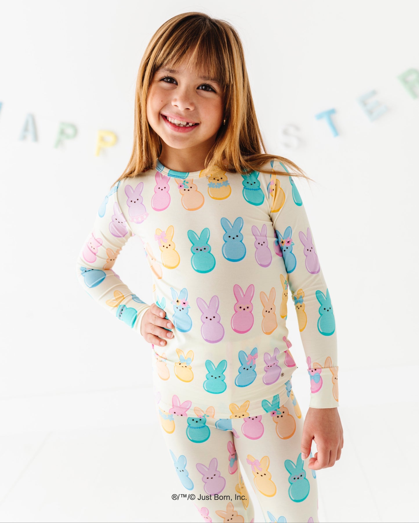 Child wearing pajamas with PEEPS® print on a white background