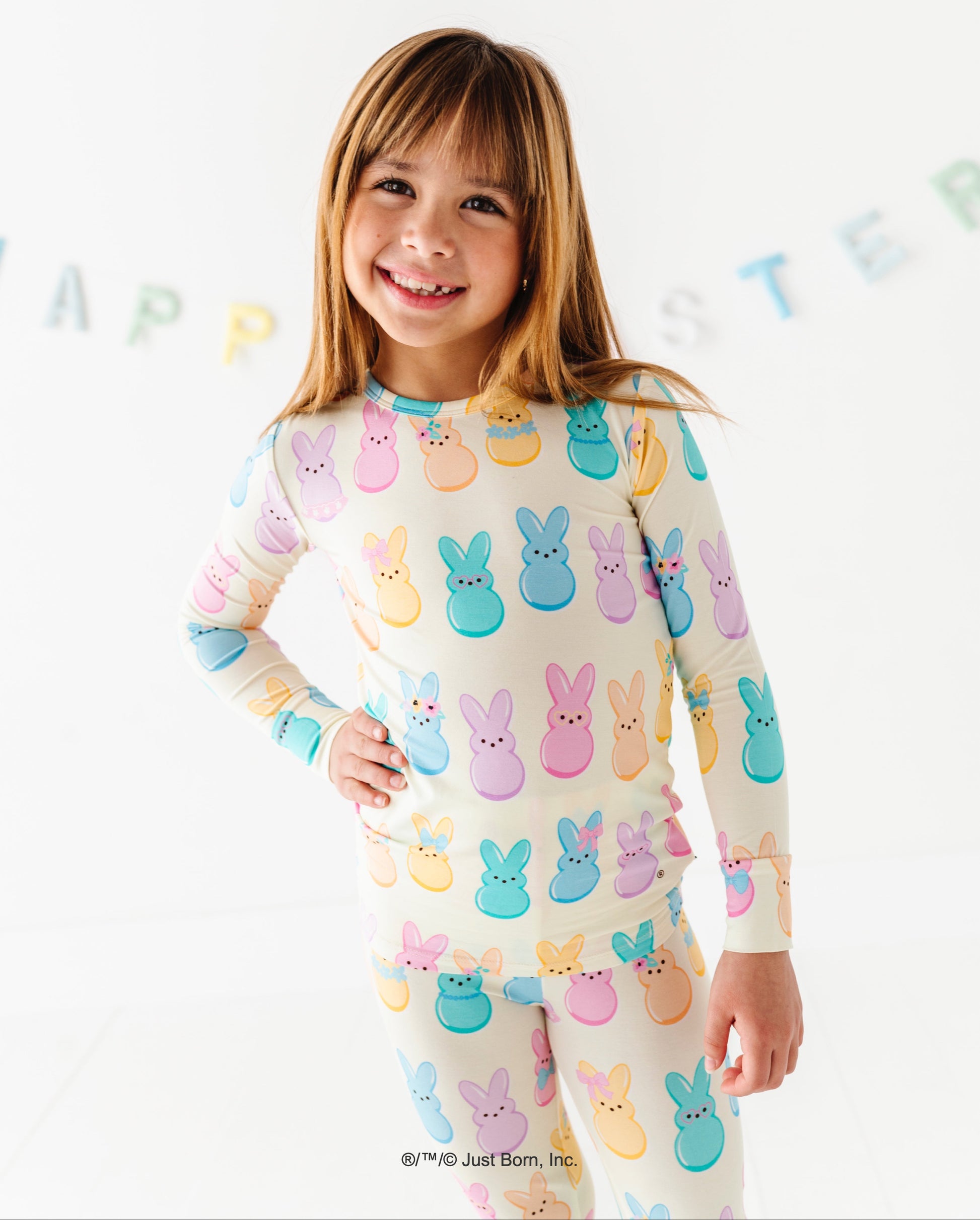Child wearing pajamas with PEEPS® print on a white background