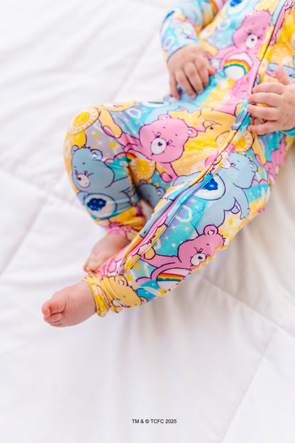Detail shot of Care Bears™ Stare bamboo romper fabric showing stretch and smooth finish
