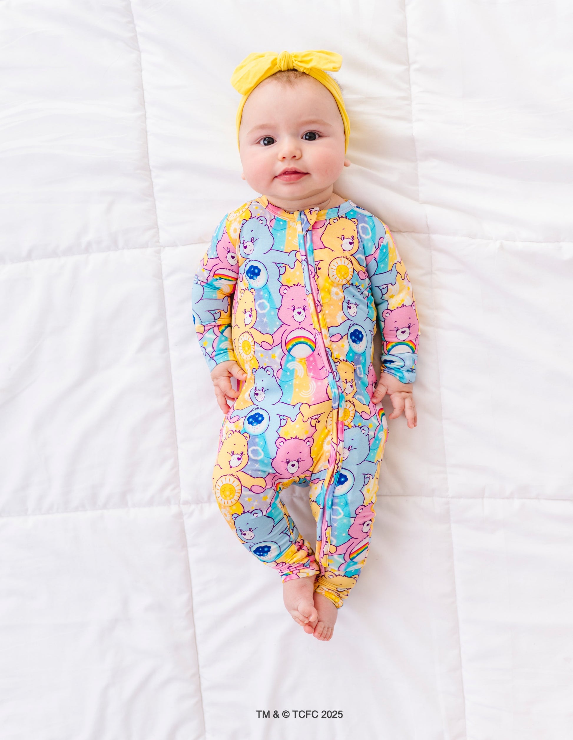 Infant wearing Care Bears™ Stare romper with convertible feet and snug sleep-safe fit