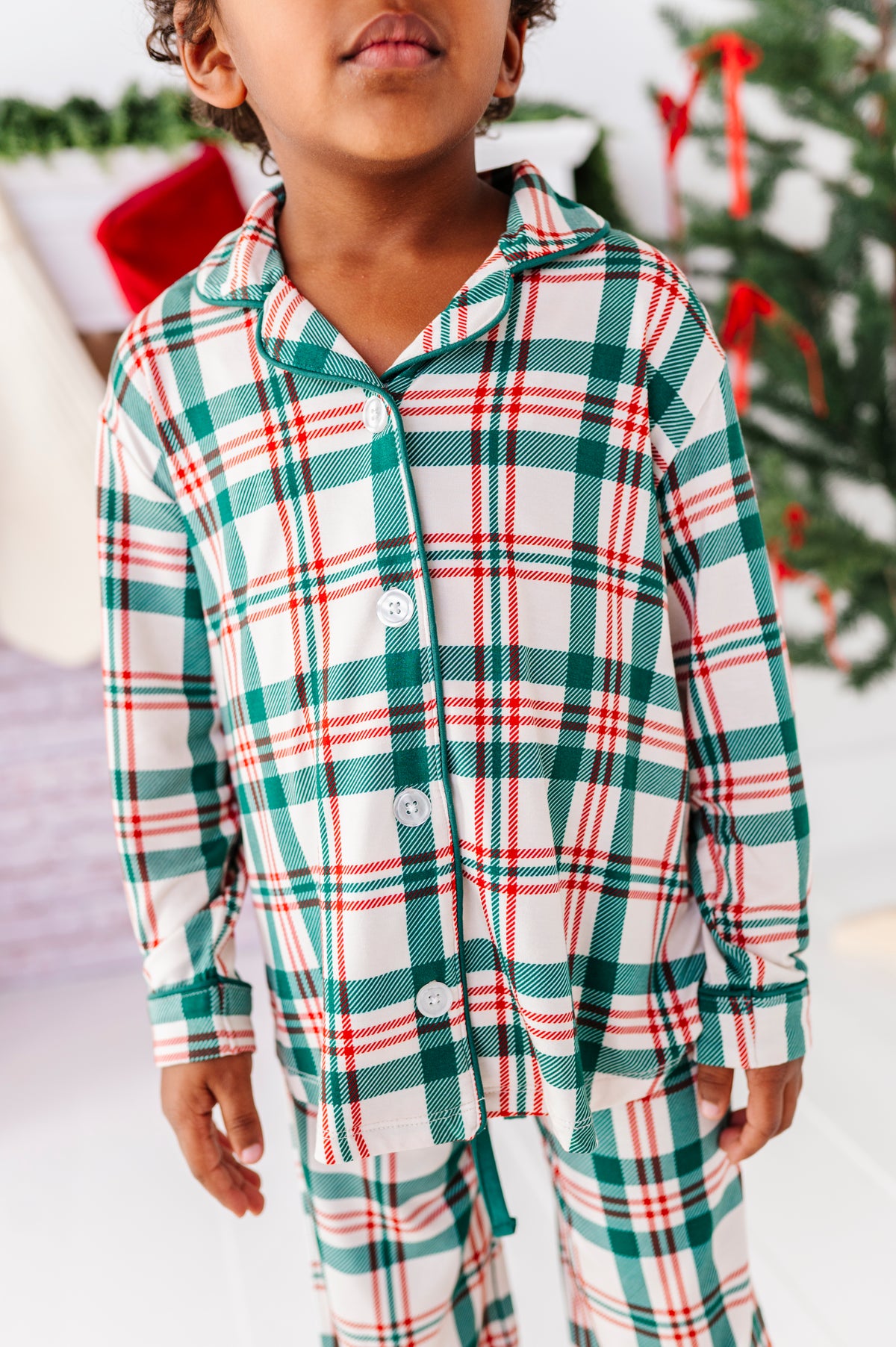 A close-up detail shot of a red, green, and cream plaid - a classic Christmas staple print for the holiday season 